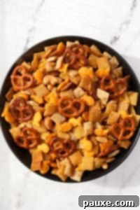 Savory Goldfish Crunch Mix 21 A bowl of homemade snack mix with pretzels, crackers, cereal, and nuts.