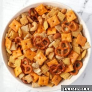 Savory Snack Medley 14 An overhead view of a bowl of Chex Mix, enticingly golden and crunchy.