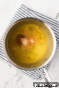 Savory Snack Medley 17 A pot filled with melted butter and seasonings, stirred together.