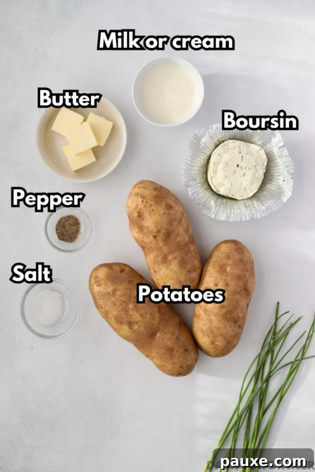 Creamy Garlic Herb Boursin Mash 3 The ingredients needed to make creamy mashed potatoes: russets, boursin, cream, butter, pepper, and salt.