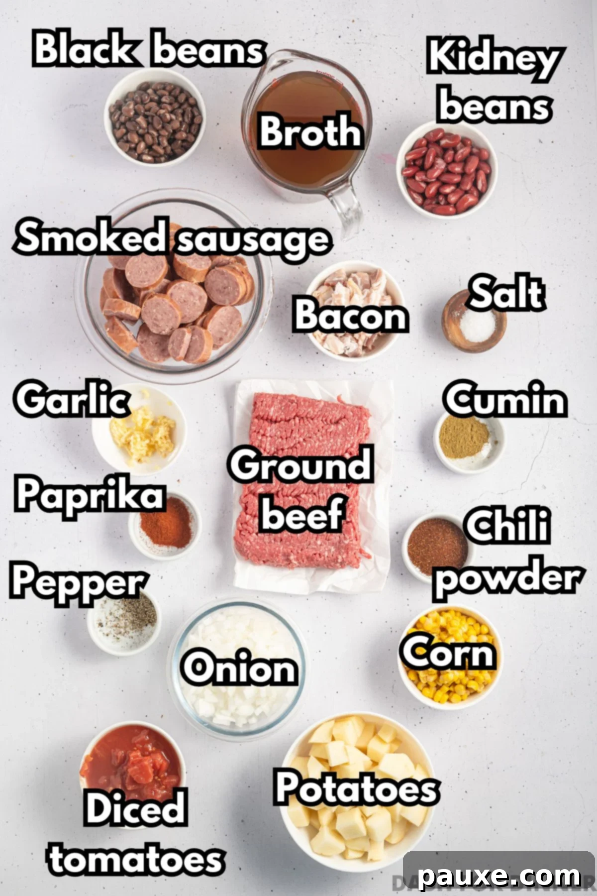 Rancher's Hearty Stew 3 All the fresh and canned ingredients laid out for making cowboy stew, including ground beef, beans, onion, potatoes, broth, and various spices.