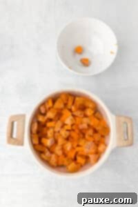 Pecan Streusel Sweet Potato Bake 16 A pot filled with water and sweet potato cubes.