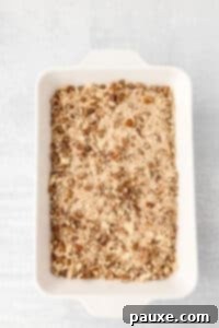 Pecan Streusel Sweet Potato Bake 22 A baking dish filled with an unbaked sweet potato casserole with a pecan crumble.