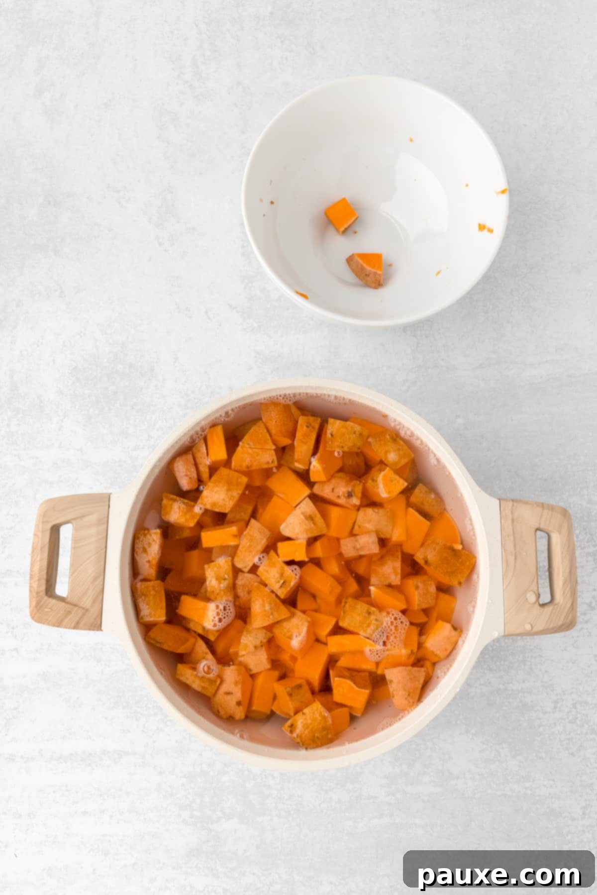 Pecan Streusel Sweet Potato Bake 4 A pot filled with water and sweet potato cubes.