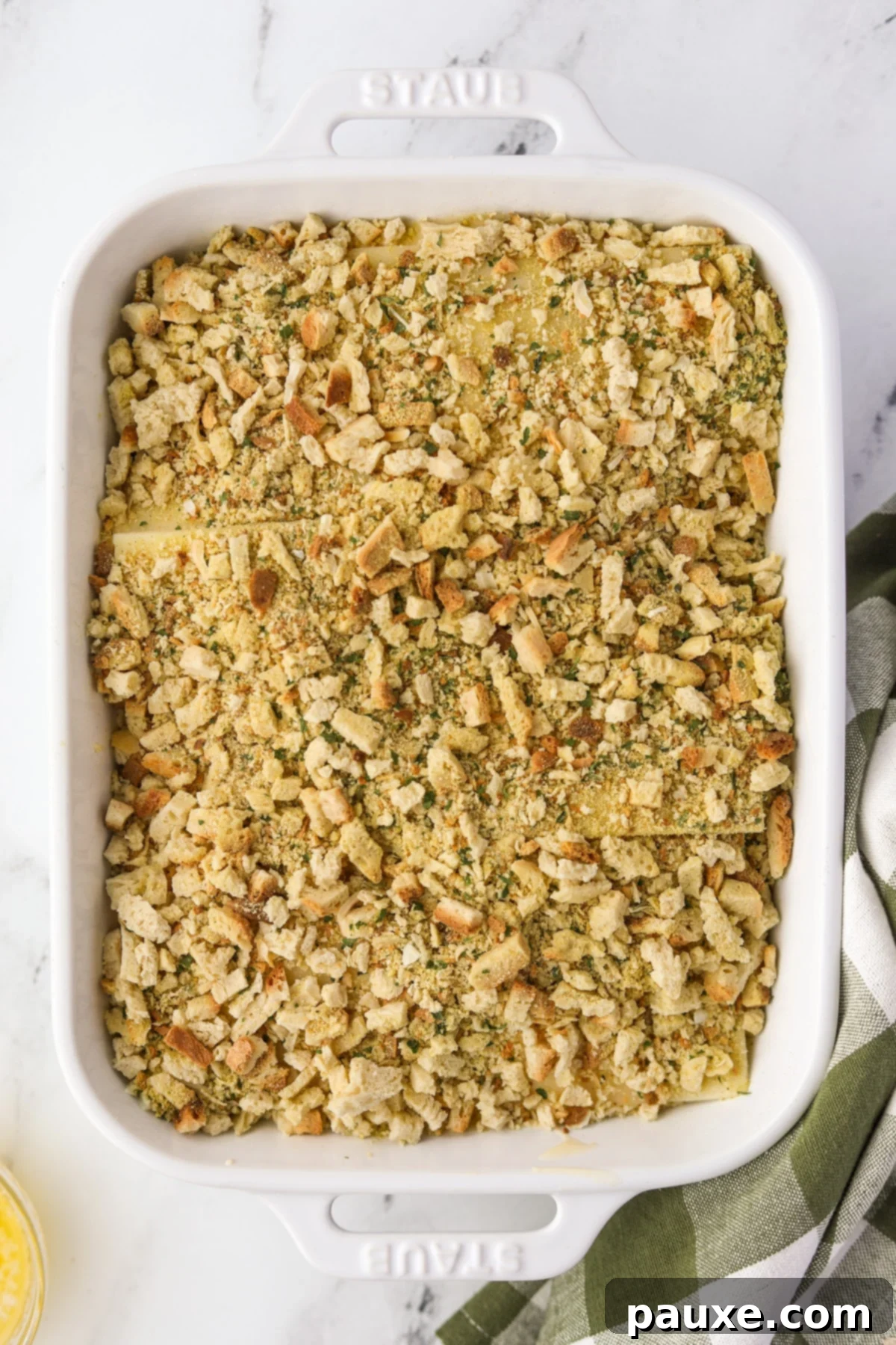 Alpine Chicken Comfort Bake 10 A baking dish filled with the assembled chicken and stuffing casserole, ready for the oven.