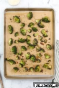 Zesty Ranch Roasted Broccoli 18 Roasted broccoli on a baking sheet.