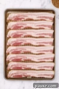 Decadent Glazed Bacon 13 A baking sheet filled with bacon slices.