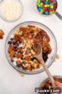 Trailblazer's Blend 14 A large bowl filled with mixed nuts, dried fruit, and coconut.