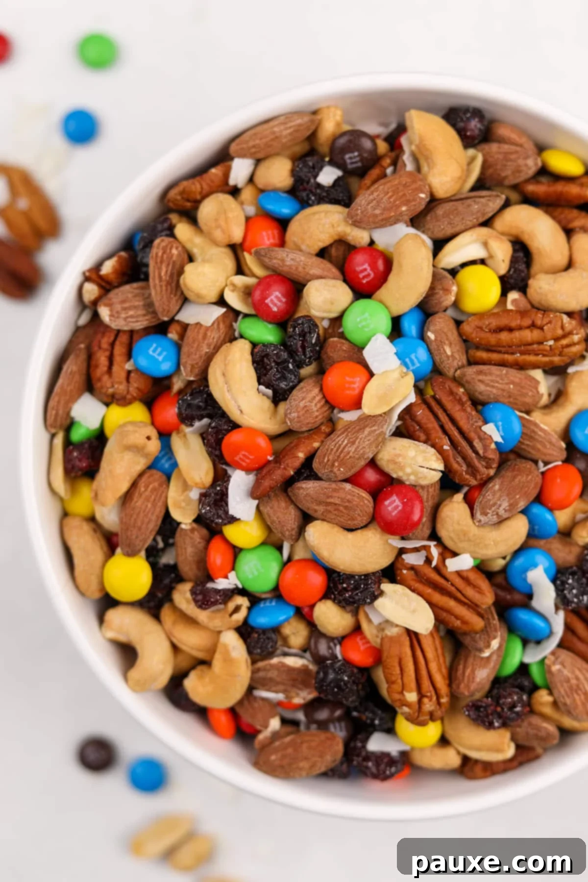 Trailblazer's Blend 9 A big white bowl filled with a colorful homemade trail mix, featuring nuts and M&M's.