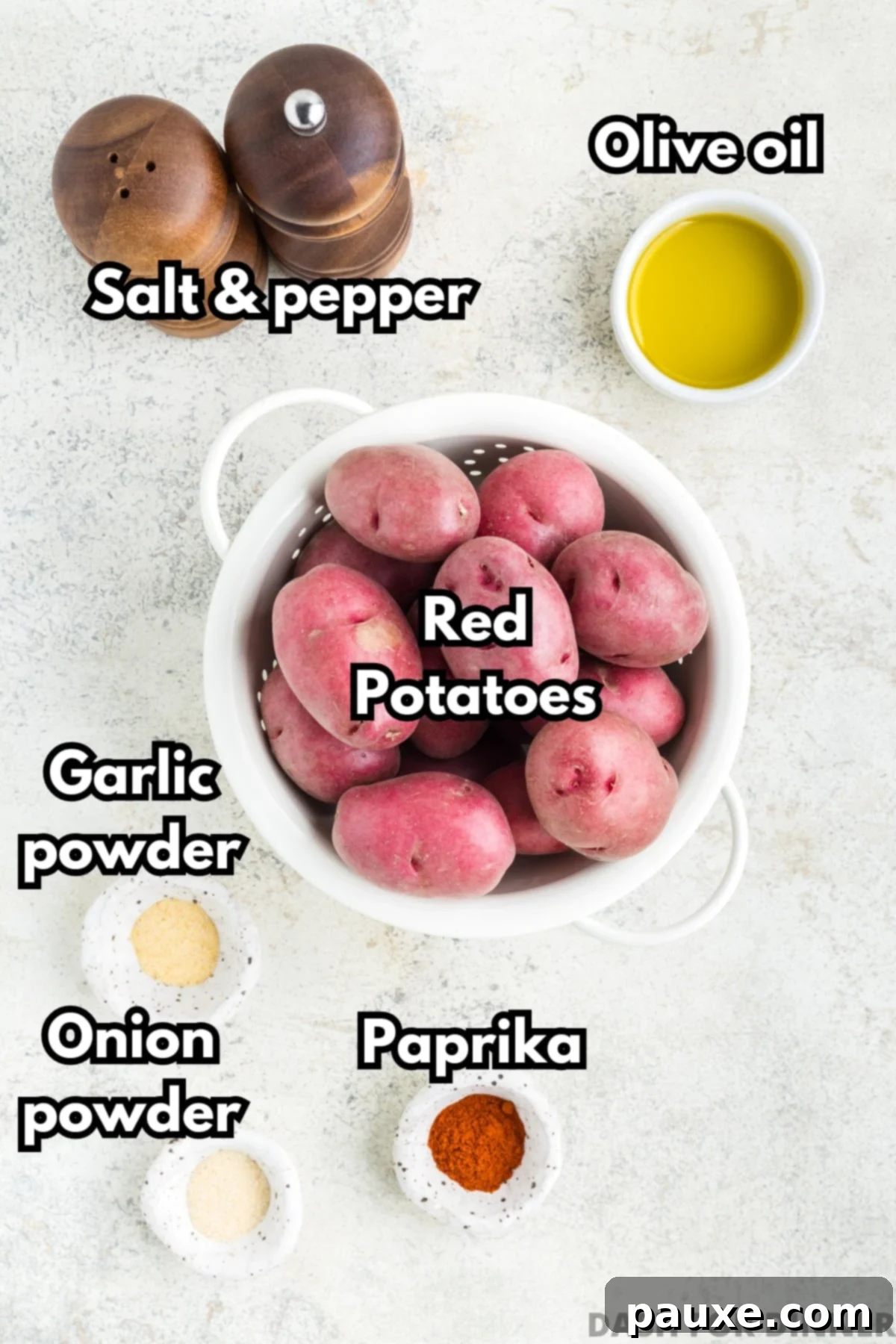The array of fresh ingredients required to make delicious air fryer baby potatoes, including whole red potatoes, olive oil, and various spices.