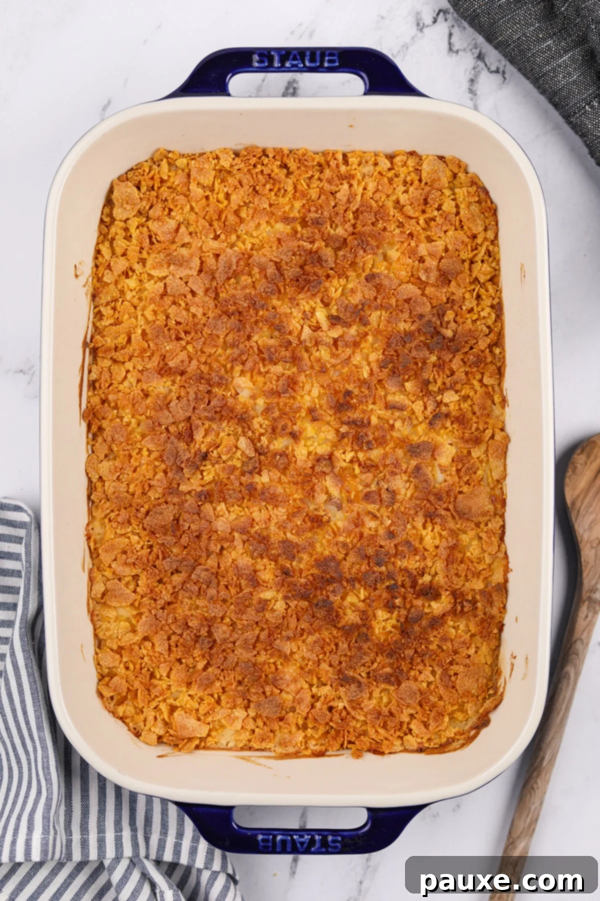 Gluten-Free Cheesy Hash Brown Casserole 13 A beautifully baked gluten-free hash brown casserole, fresh from the oven, with a perfectly golden, bubbly, and extra-crispy corn flake topping, steaming and ready to be served.