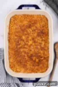 Gluten-Free Cheesy Hash Brown Casserole 27 A baking dish filled with a corn flake topped casserole.