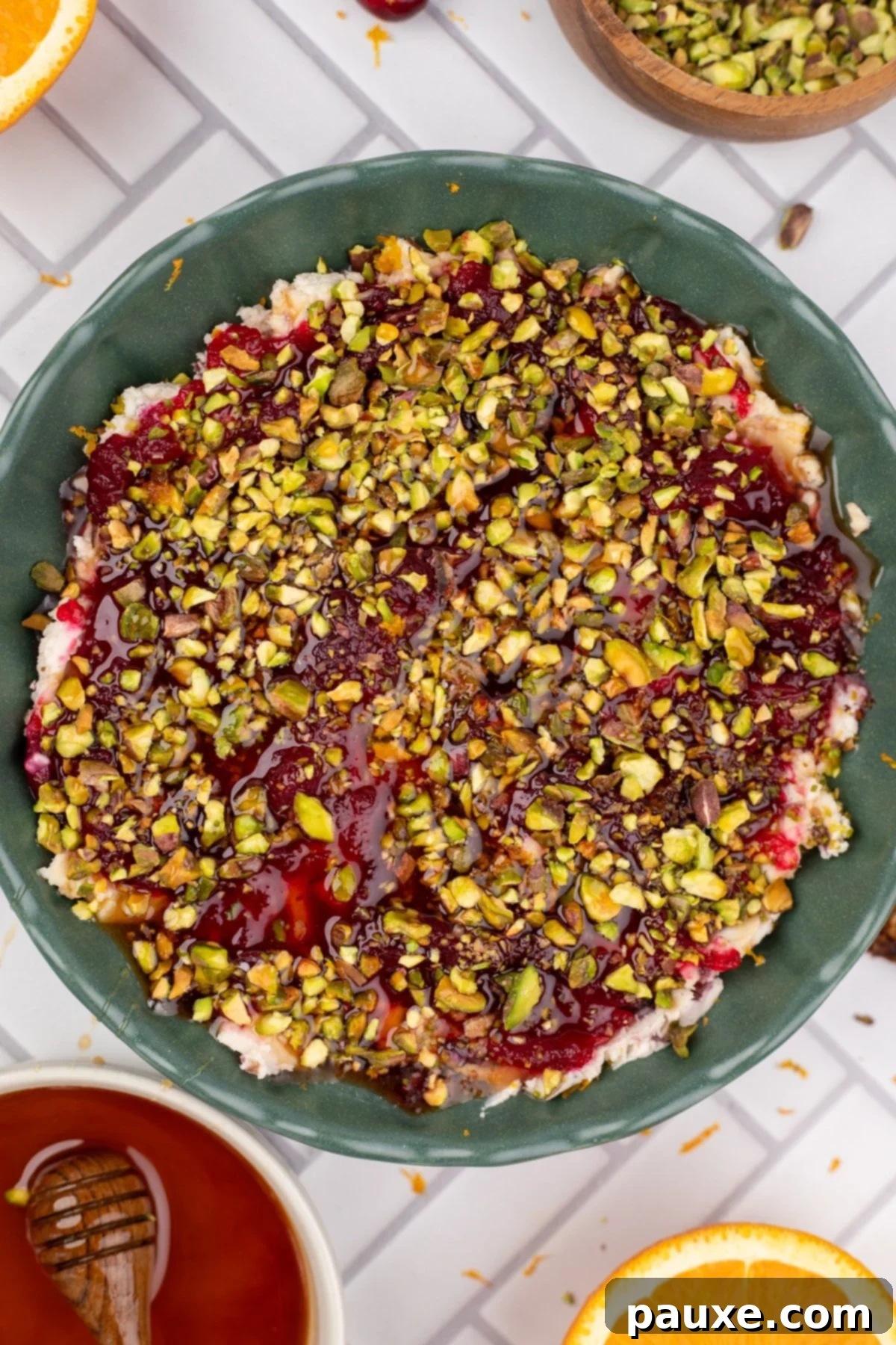 Bowl of Cranberry Boursin Dip garnished with pistachios