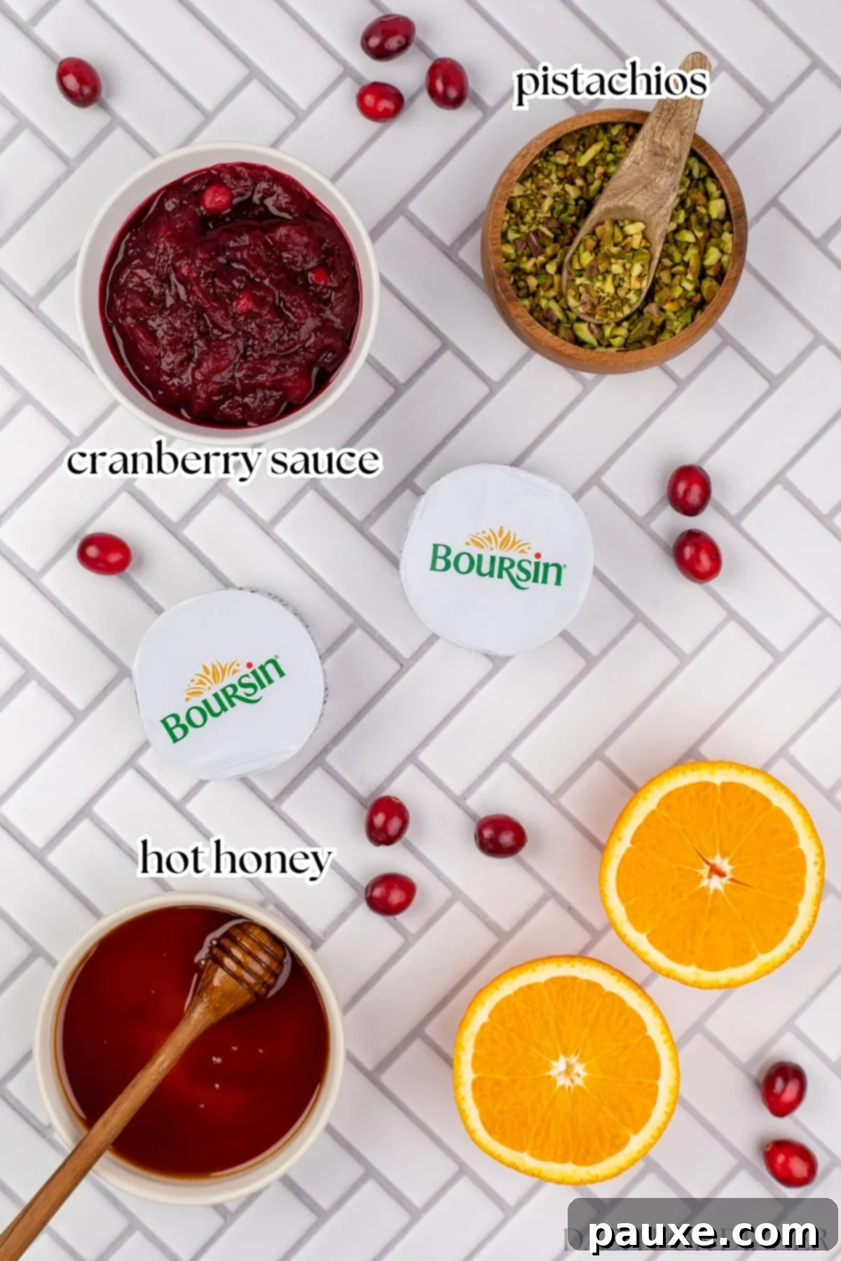 Ingredients for Cranberry Boursin Dip including Boursin cheese, cranberry sauce, pistachios, and hot honey
