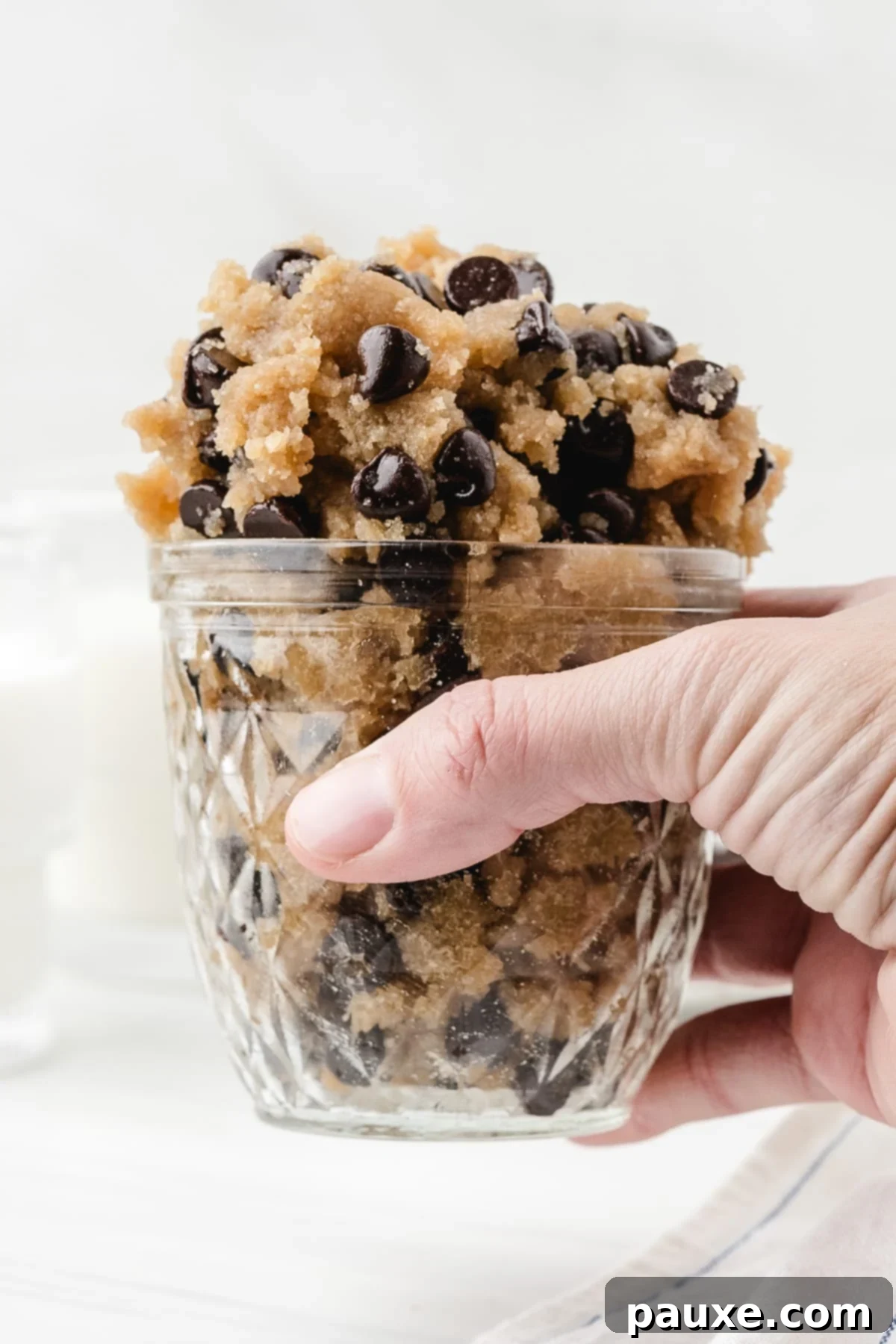 Safe-to-Eat Cookie Dough 7 A parfait glass overflowing with raw cookie dough.