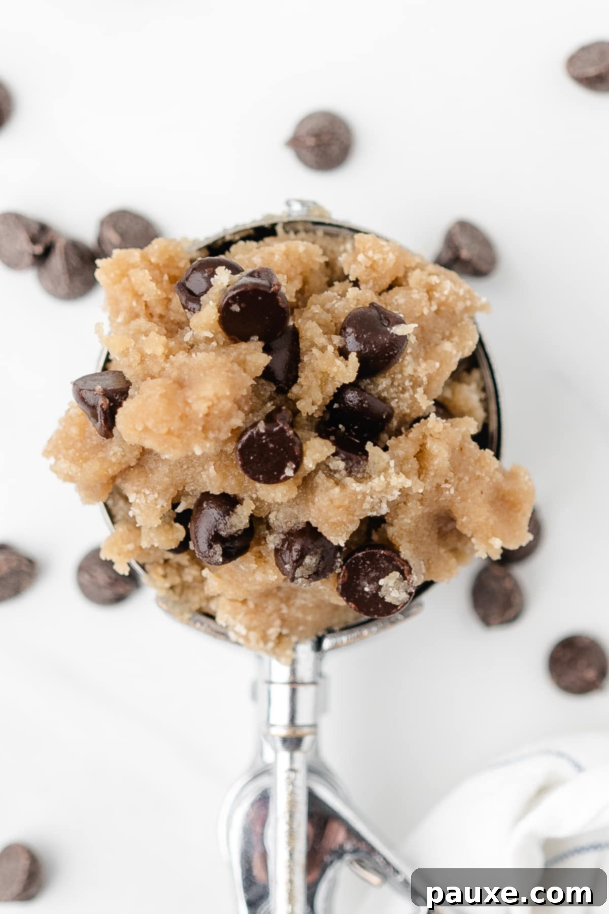 Safe-to-Eat Cookie Dough 8 A scoop of cookie dough filled with chocolate chips.