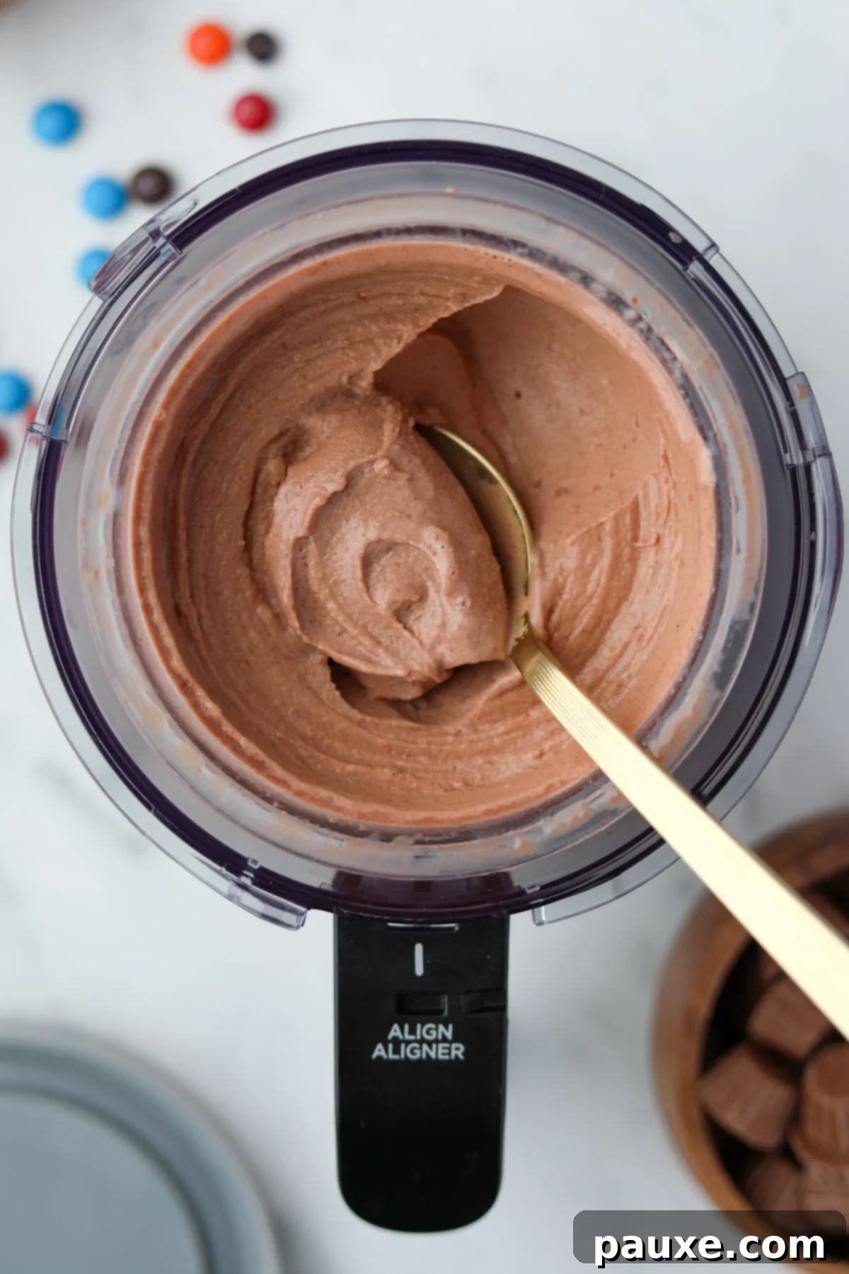 Ninja Creami Chocolate Protein Dream 2 Ninja Creami Chocolate Protein Ice Cream being scooped from the container