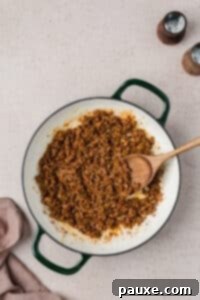 Taco Mac 'n' Cheese Explosion 10 A skillet filled with seasoned ground beef.