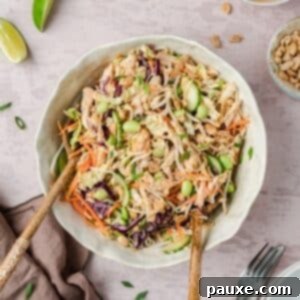 Bang Bang Chicken Salad: A Flavor Explosion 9 A bowl of bang bang chicken salad being tossed.