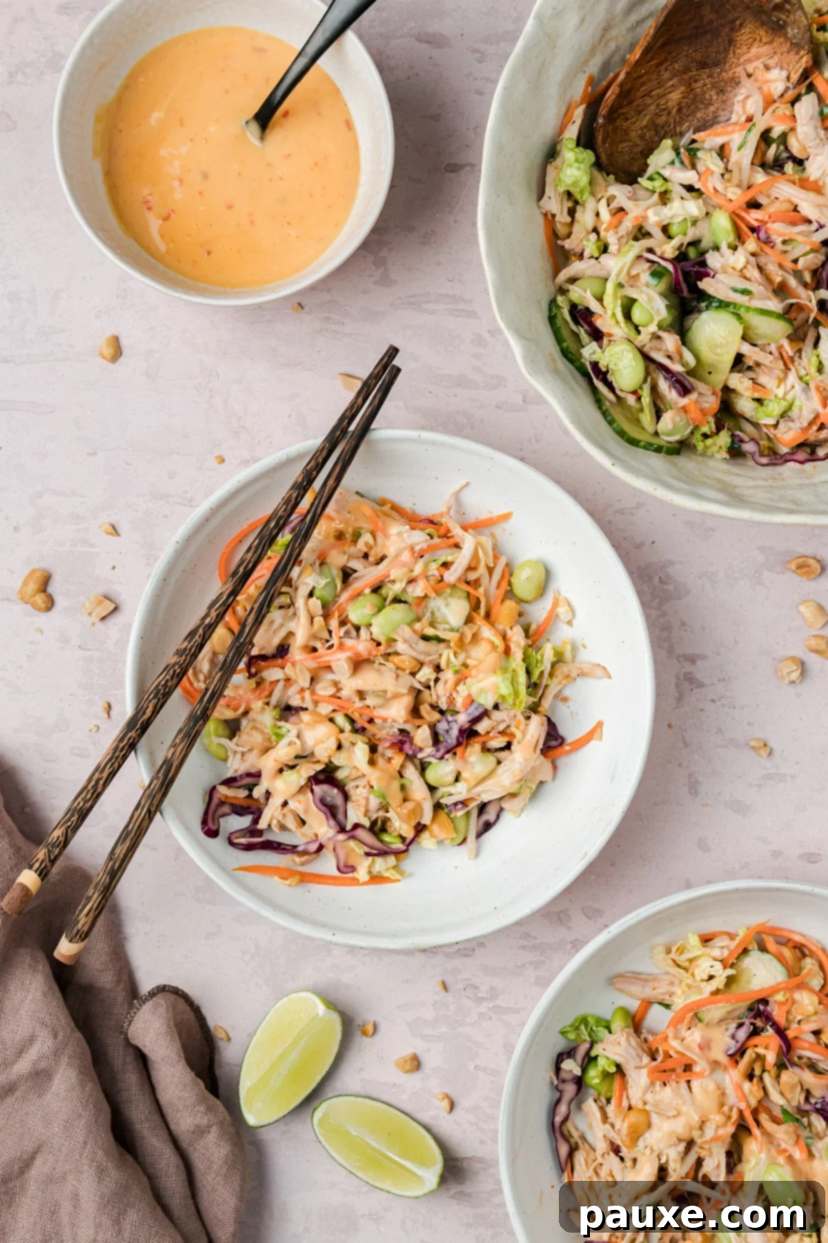 Bang Bang Chicken Salad: A Flavor Explosion 7 Bang Bang Chicken Salad served with chopsticks and extra sauce.